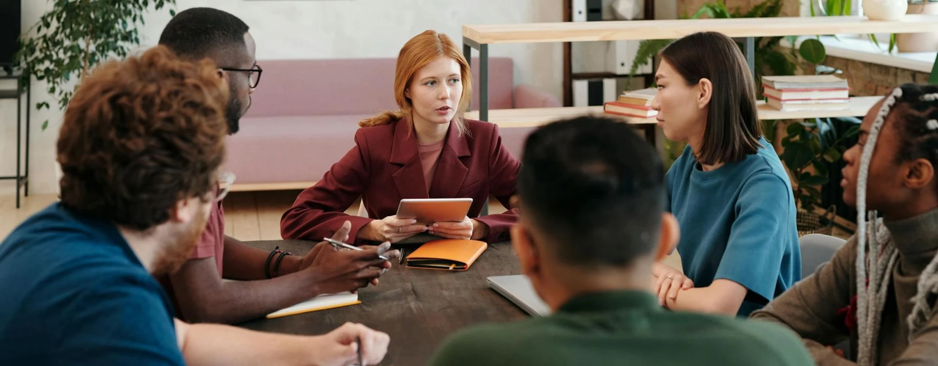 People discussing ideas around a table