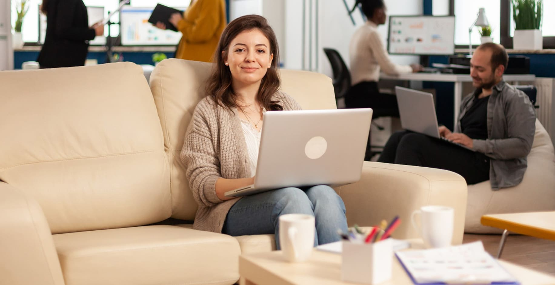 Woman working on a laptop in a shared office